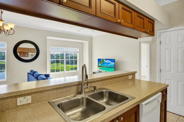 a kitchen with a sink and a refrigerator