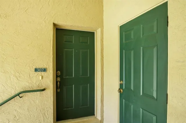 a bathroom with a shower and a sink