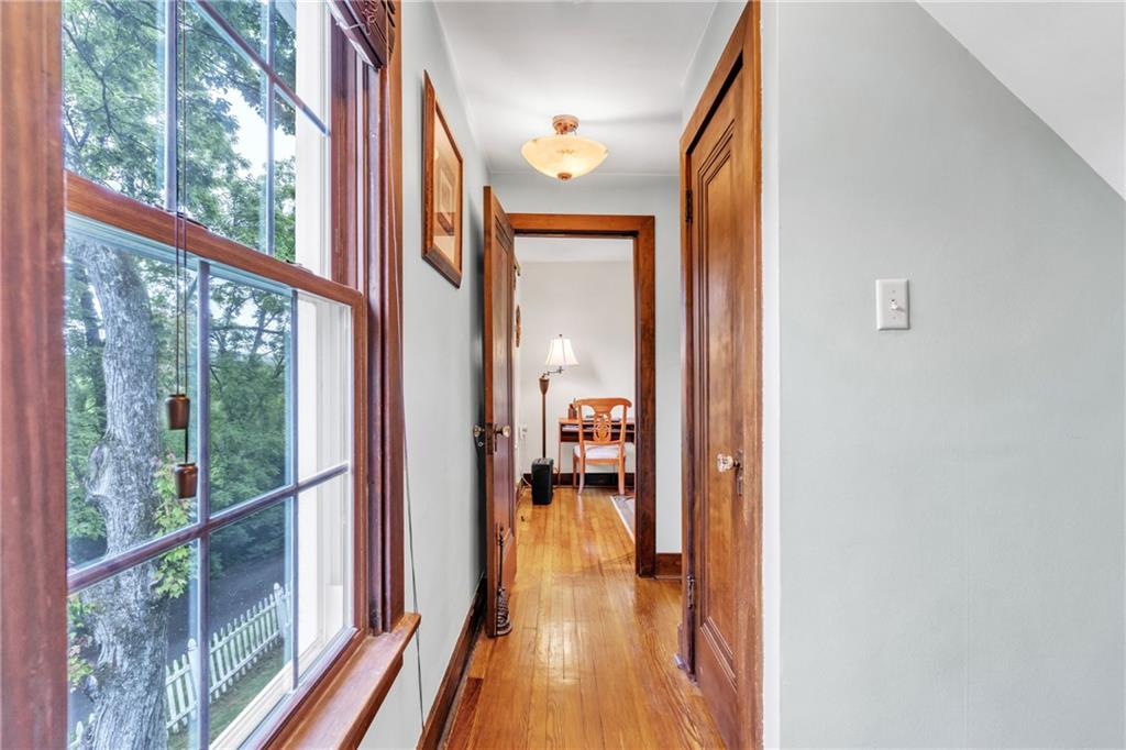 461 Manor Road Wexford, PA 15090 - Photo 14 of 43 a view of a hallway with wooden floor and windows