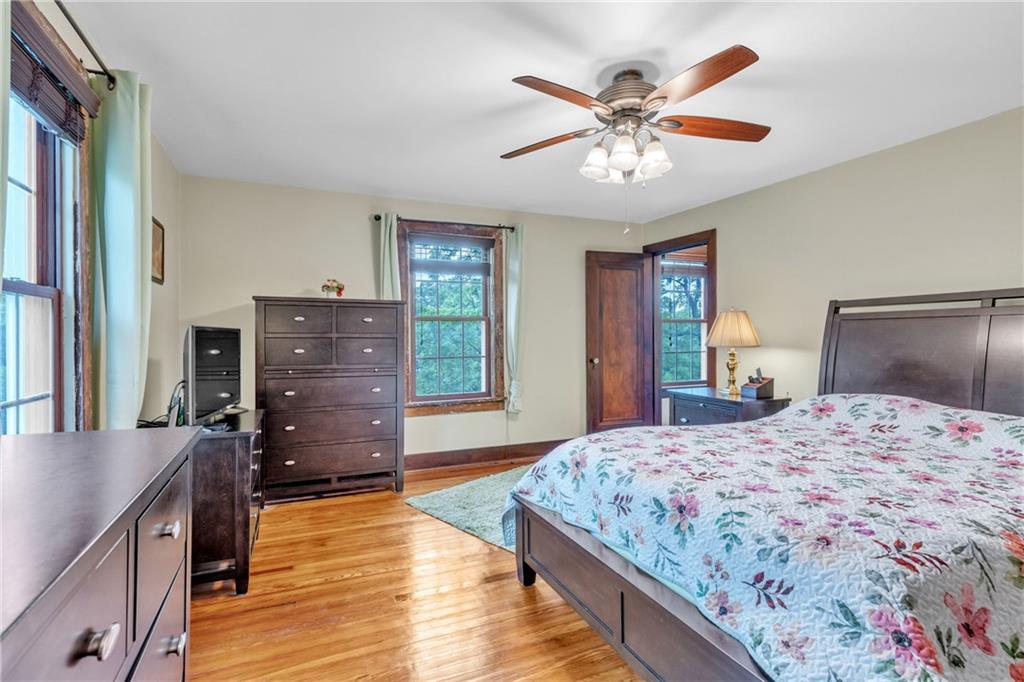 461 Manor Road Wexford, PA 15090 - Photo 17 of 43 a bedroom with a bed and wooden floor