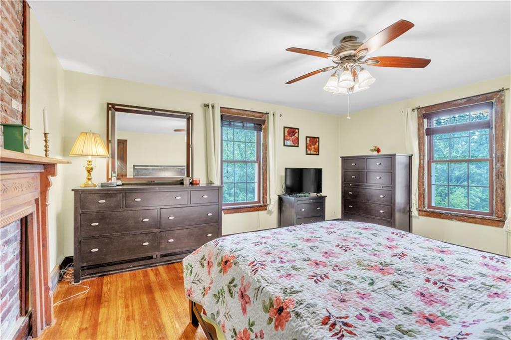 461 Manor Road Wexford, PA 15090 - Photo 18 of 43 a bedroom with a large bed and a flat tv screen on dresser