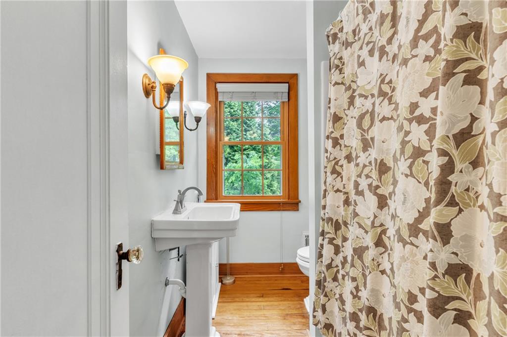 461 Manor Road Wexford, PA 15090 - Photo 19 of 43 a bathroom with a sink mirror and a window
