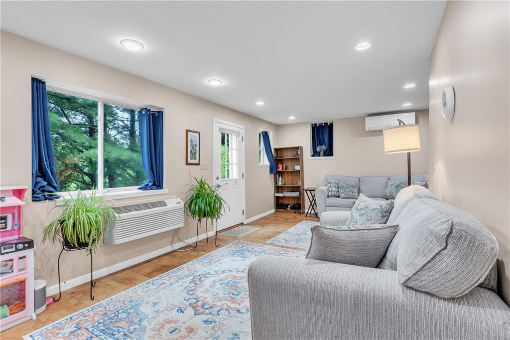 461 Manor Road Wexford, PA 15090 - Photo 23 of 43 a living room with furniture and a large window