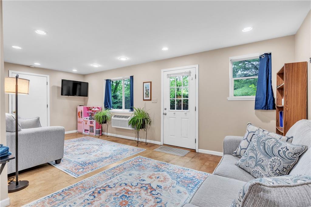 461 Manor Road Wexford, PA 15090 - Photo 25 of 43 a living room with furniture and a flat screen tv