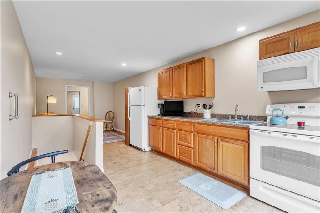 461 Manor Road Wexford, PA 15090 - Photo 27 of 43 a kitchen with granite countertop a sink cabinets and window