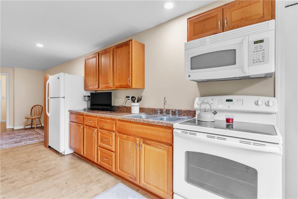461 Manor Road Wexford, PA 15090 - Photo 28 of 43 a kitchen with stainless steel appliances granite countertop a stove and a sink