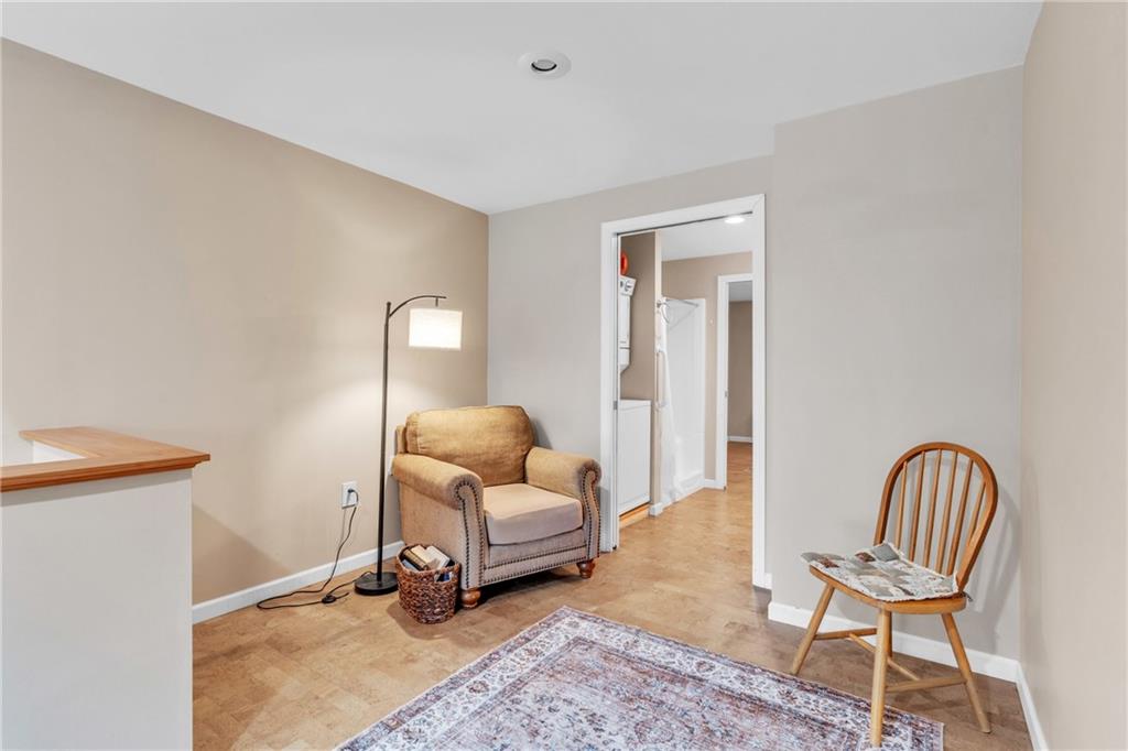 461 Manor Road Wexford, PA 15090 - Photo 30 of 43 a room with a chair and a rug