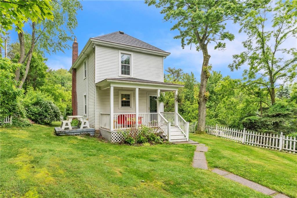 461 Manor Road Wexford, PA 15090 - Photo 3 of 43 a front view of a house with a yard table and chairs