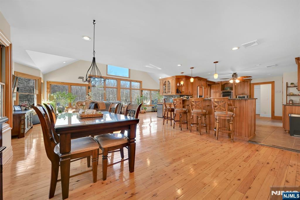 285 Chestnut Ridge Road Woodcliff Lake, NJ 07677 - Photo 24 of 46 a view of a dining room with furniture and wooden floor