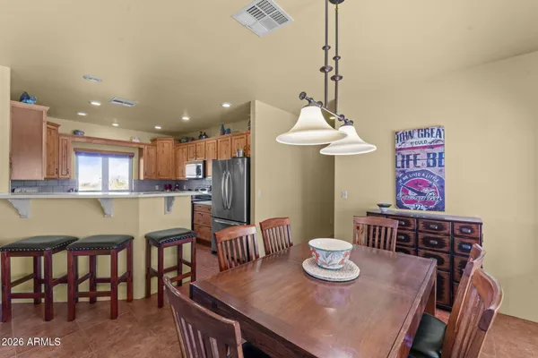 a view of a dining room with furniture
