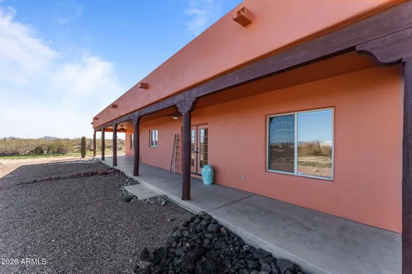a view of a livingroom with furniture and a car parked