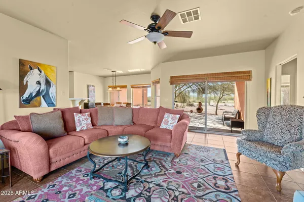 a living room with furniture and a large window