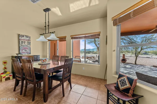 a view of a dining room with furniture window and outside view