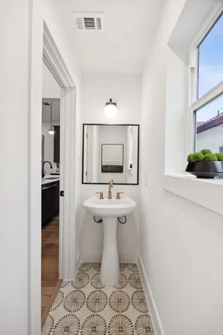 a bathroom with a sink and a mirror