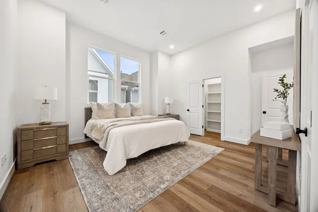 a bedroom with a bed and dresser