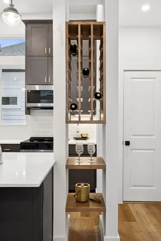 a kitchen with a sink a stove and cabinets