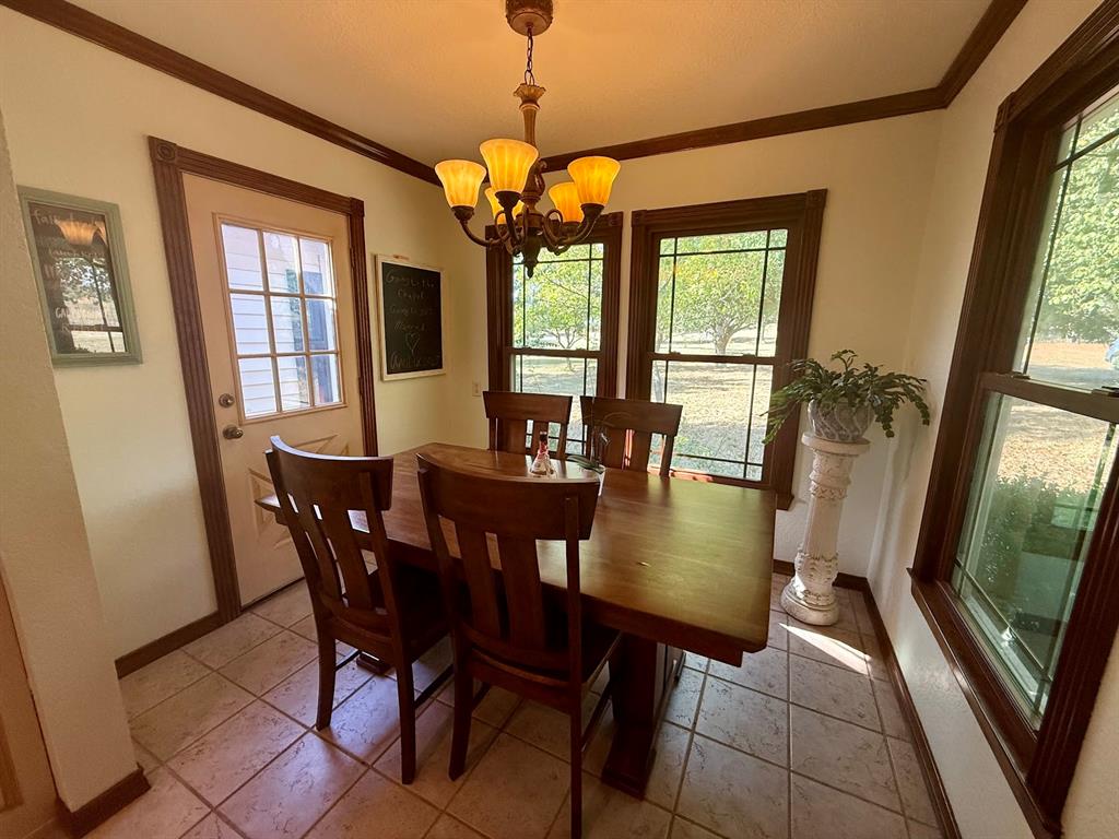 3420 Springfield Road Springtown, TX 76082 - Photo 24 of 38 a view of a dining room with furniture window and outside view