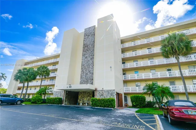 a sign on the side of the tree