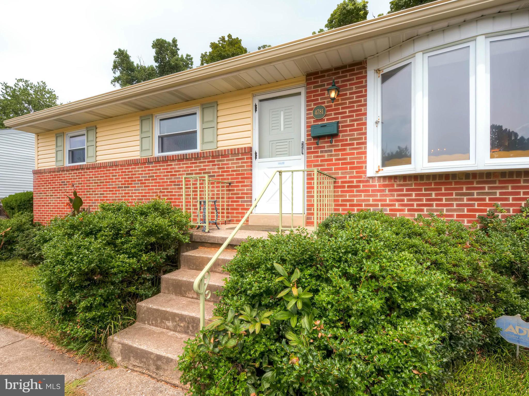 4781 Byron Road Baltimore, MD 21244 - Photo 3 of 28 a front view of a house with a yard