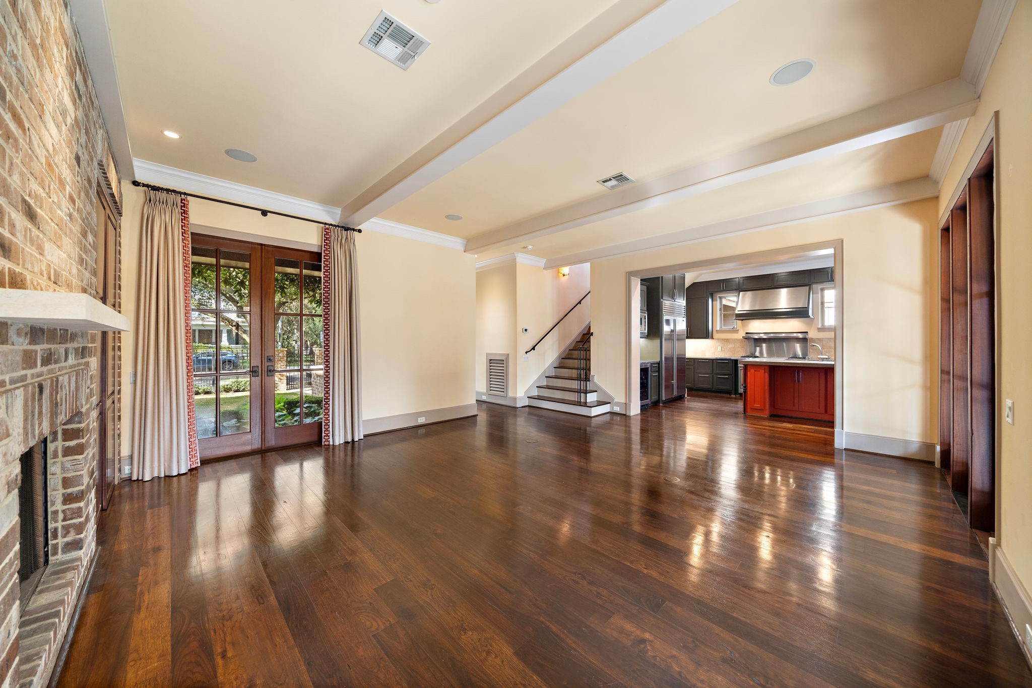 3603 Audubon Place Houston, TX 77006 - Photo 11 of 29 a view of an empty room with wooden floor and a window