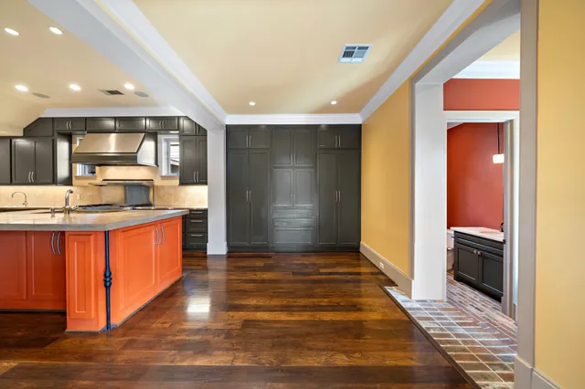 a kitchen with stainless steel appliances granite countertop a refrigerator and a sink