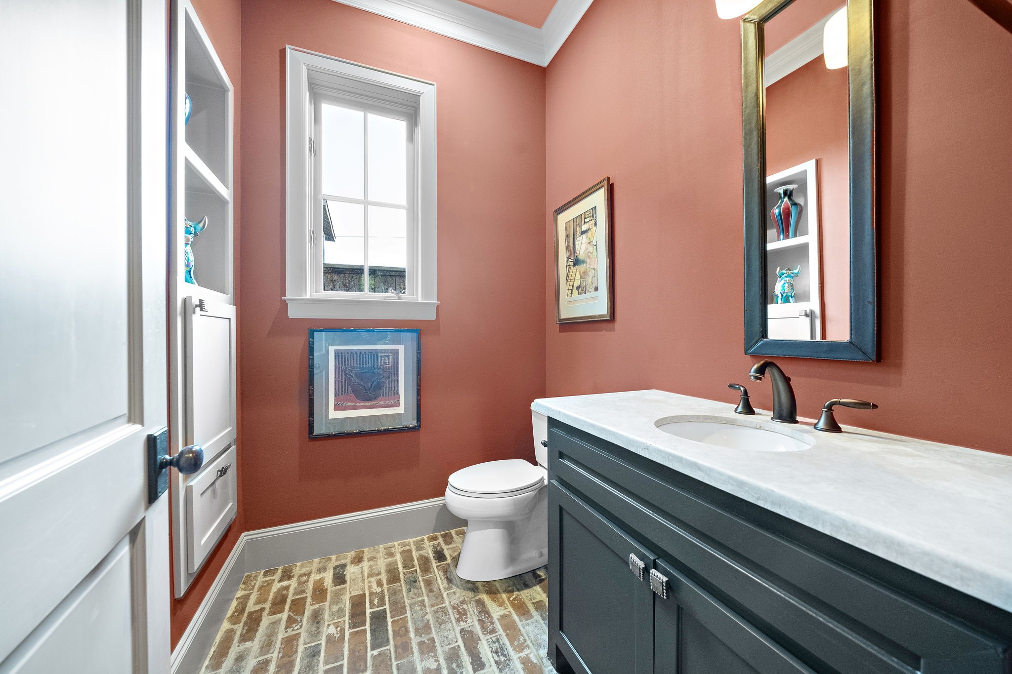 3603 Audubon Place Houston, TX 77006 - Photo 15 of 29 a bathroom with a sink a toilet and a mirror