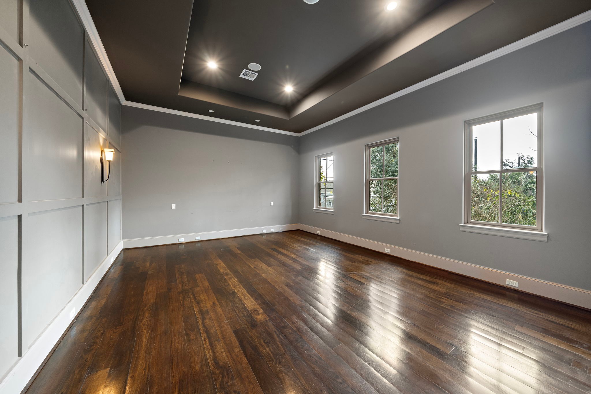 3603 Audubon Place Houston, TX 77006 - Photo 20 of 29 an empty room with wooden floor and windows