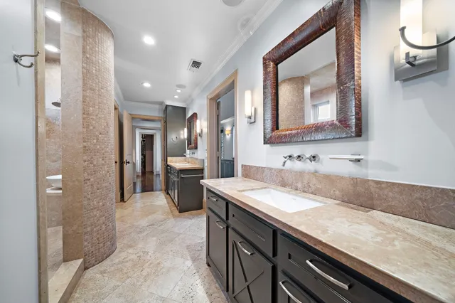 a bathroom with a granite countertop sink mirror and double