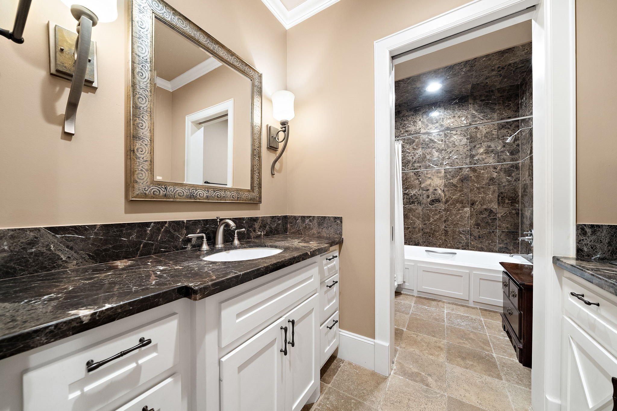 3603 Audubon Place Houston, TX 77006 - Photo 24 of 29 a bathroom with a sink and a mirror with bathtub