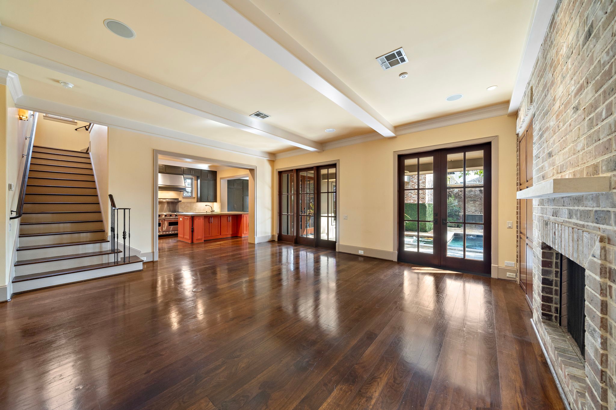 3603 Audubon Place Houston, TX 77006 - Photo 10 of 29 wooden floor in an empty room with fireplace and wooden floor