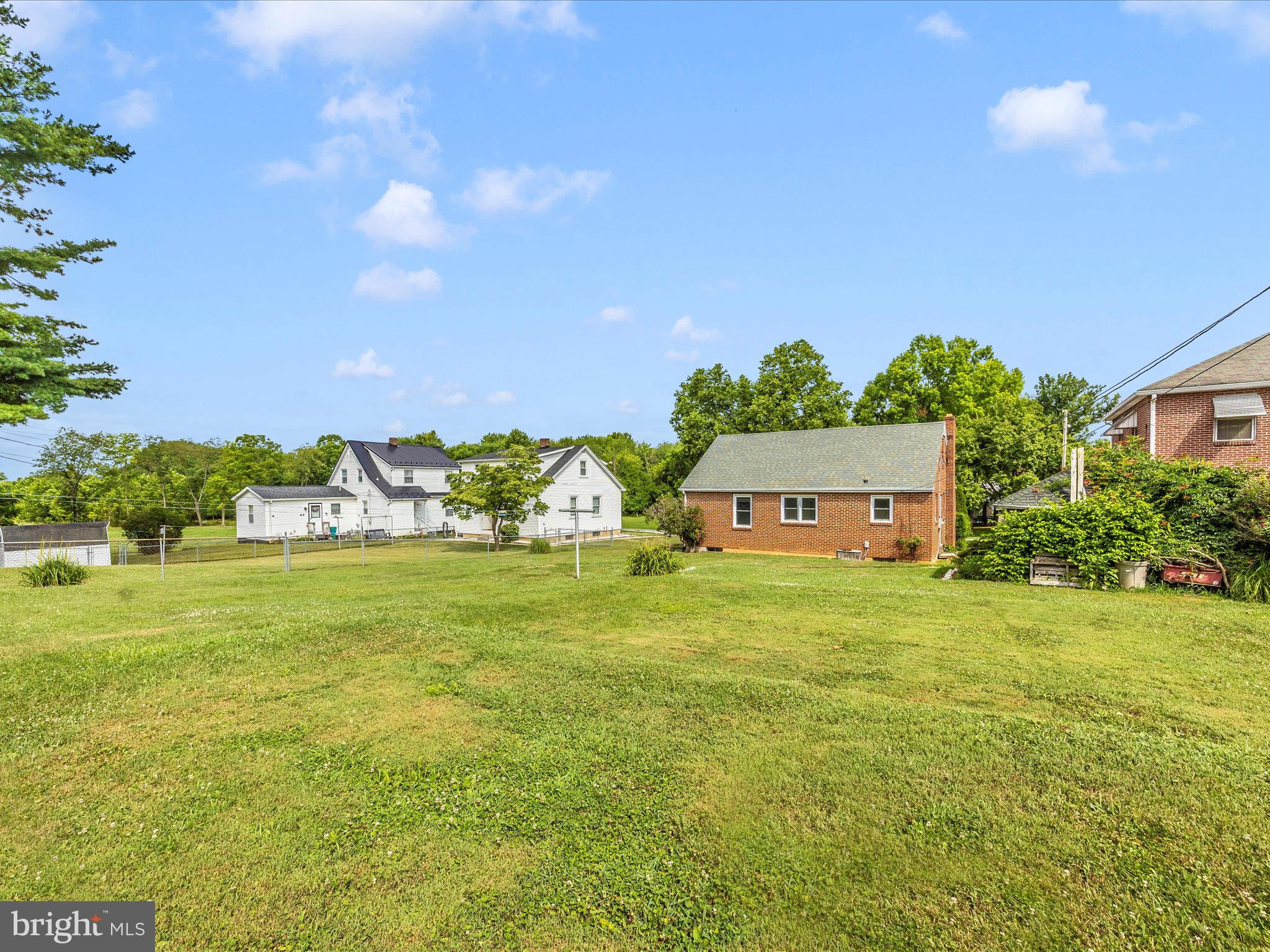 6 Park View Boonsboro, MD 21713 - Photo 51 of 64 a front view of a house with a big yard and potted plants