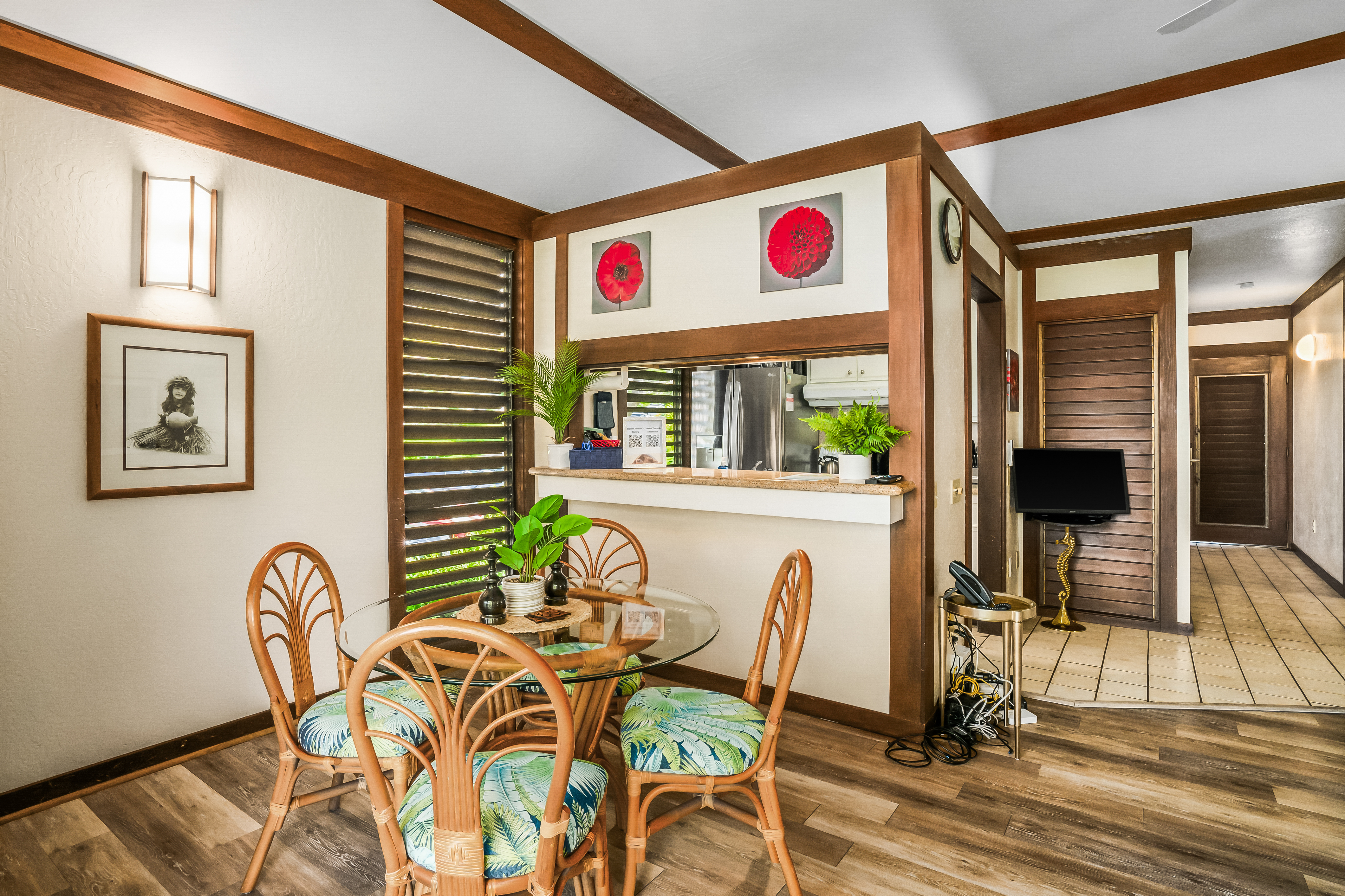 2253 Poipu Road, Unit 169 Koloa, HI 96756 - Photo 10 of 13 a view of a dining room with furniture wooden floor and front door