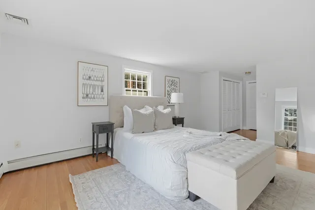 a bedroom with a bed and a couch