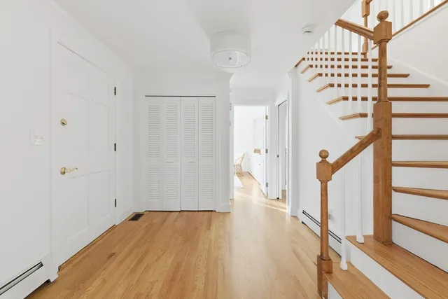 a view of entryway with wooden floor