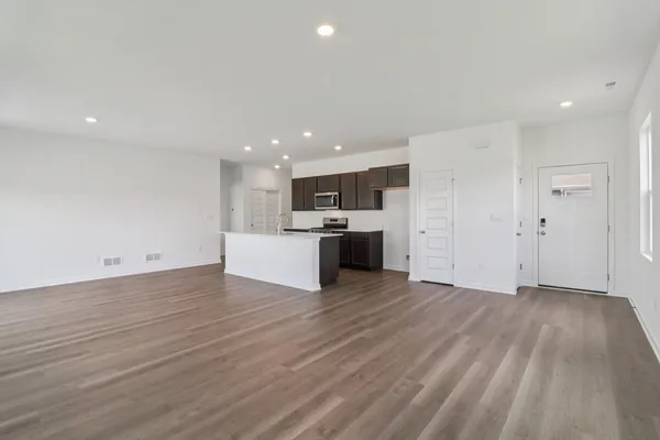 a view of kitchen with wooden floor and window