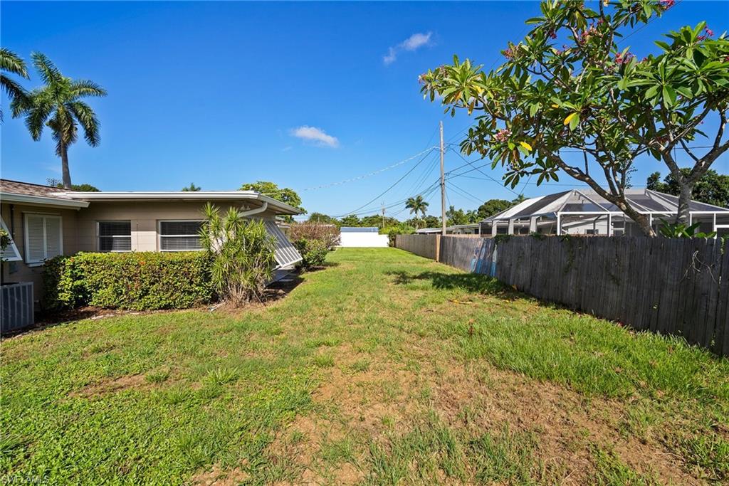1449 Charles Road Fort Myers, FL 33919 - Photo 34 of 40 View of yard featuring central AC