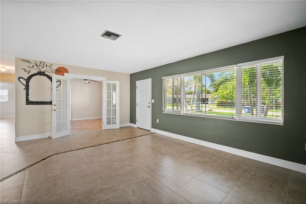 1449 Charles Road Fort Myers, FL 33919 - Photo 9 of 40 Entryway featuring tile patterned floors, french doors, and a wealth of natural light