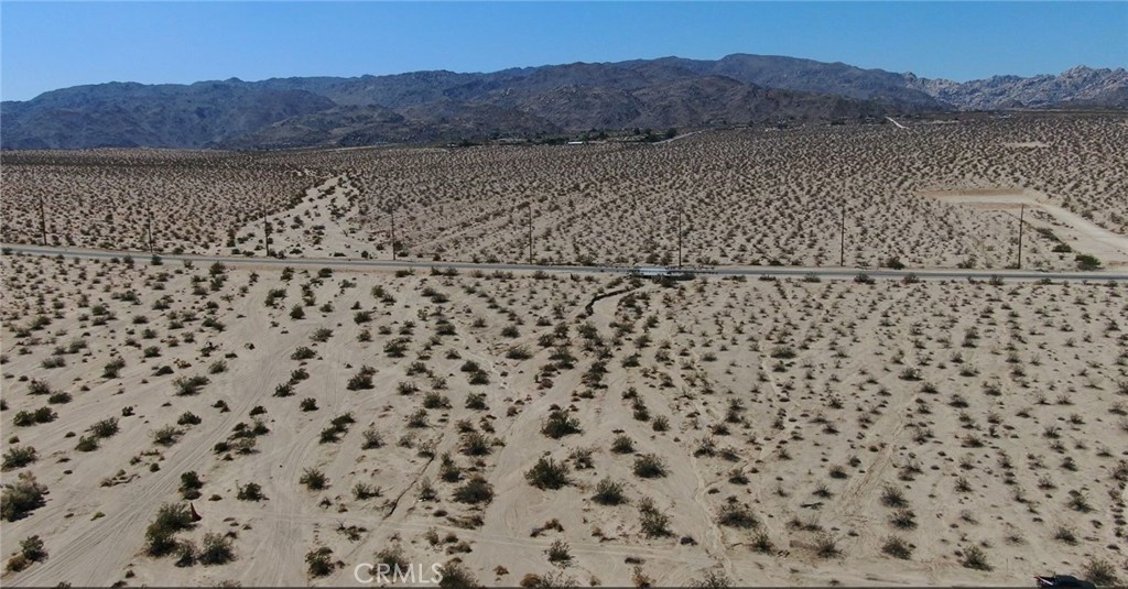 70100 2 Mile Road Twentynine Palms, CA 92277 - Photo 20 of 28 a view of a dry yard with a mountain