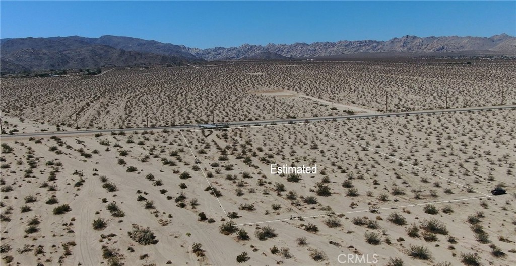 70100 2 Mile Road Twentynine Palms, CA 92277 - Photo 22 of 28 a view of a dry yard with a lake