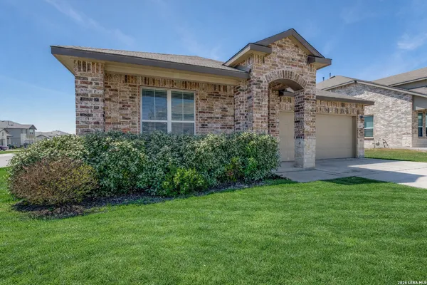 front view of a house with a yard