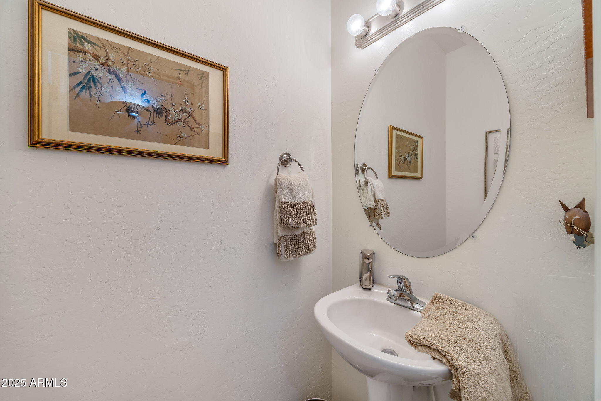 6935 Starlight Ridge Road Lakeside, AZ 85929 - Photo 10 of 32 a bathroom with a sink and a mirror