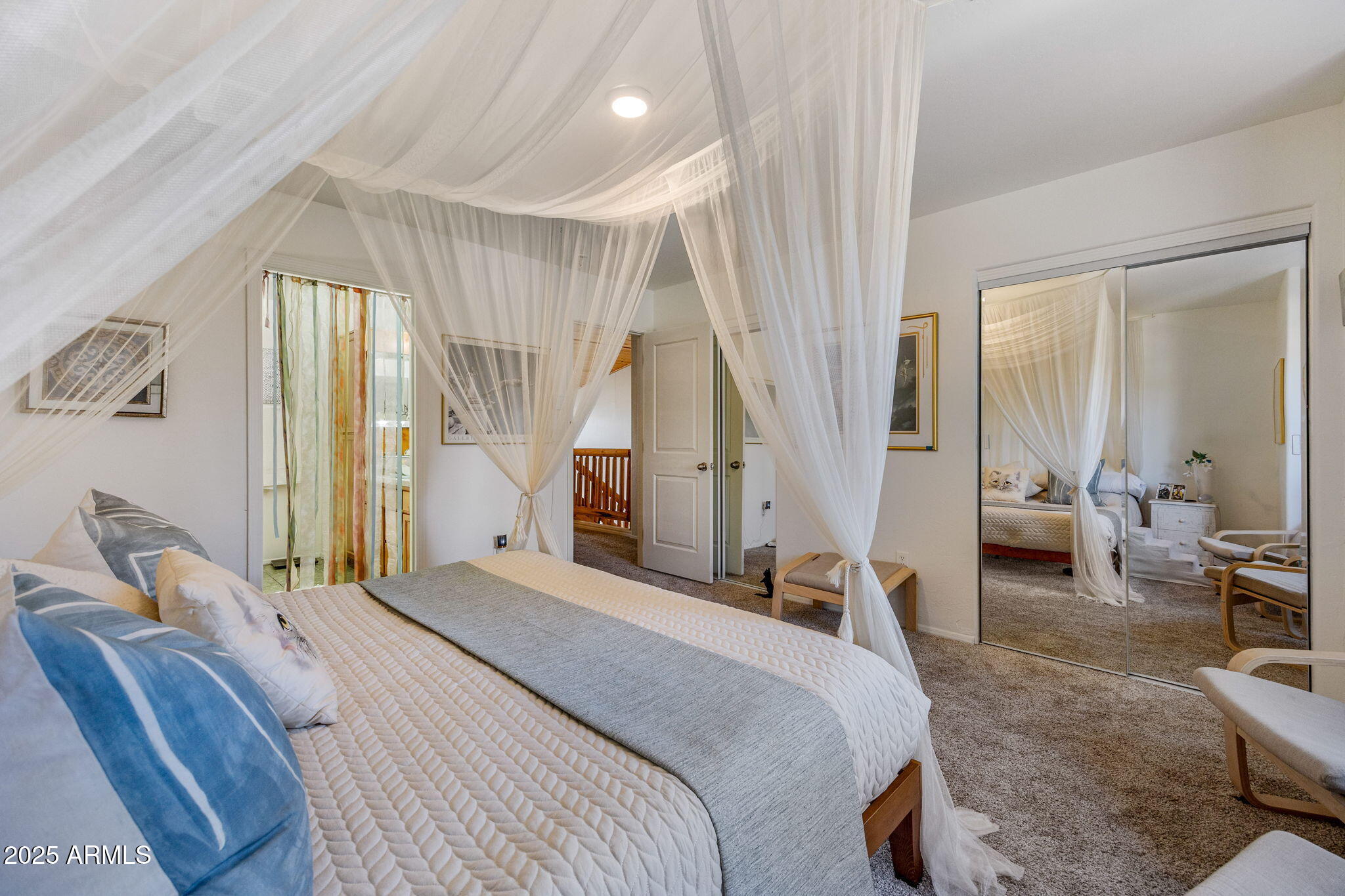 6935 Starlight Ridge Road Lakeside, AZ 85929 - Photo 13 of 32 a bedroom with a bed couch and a window