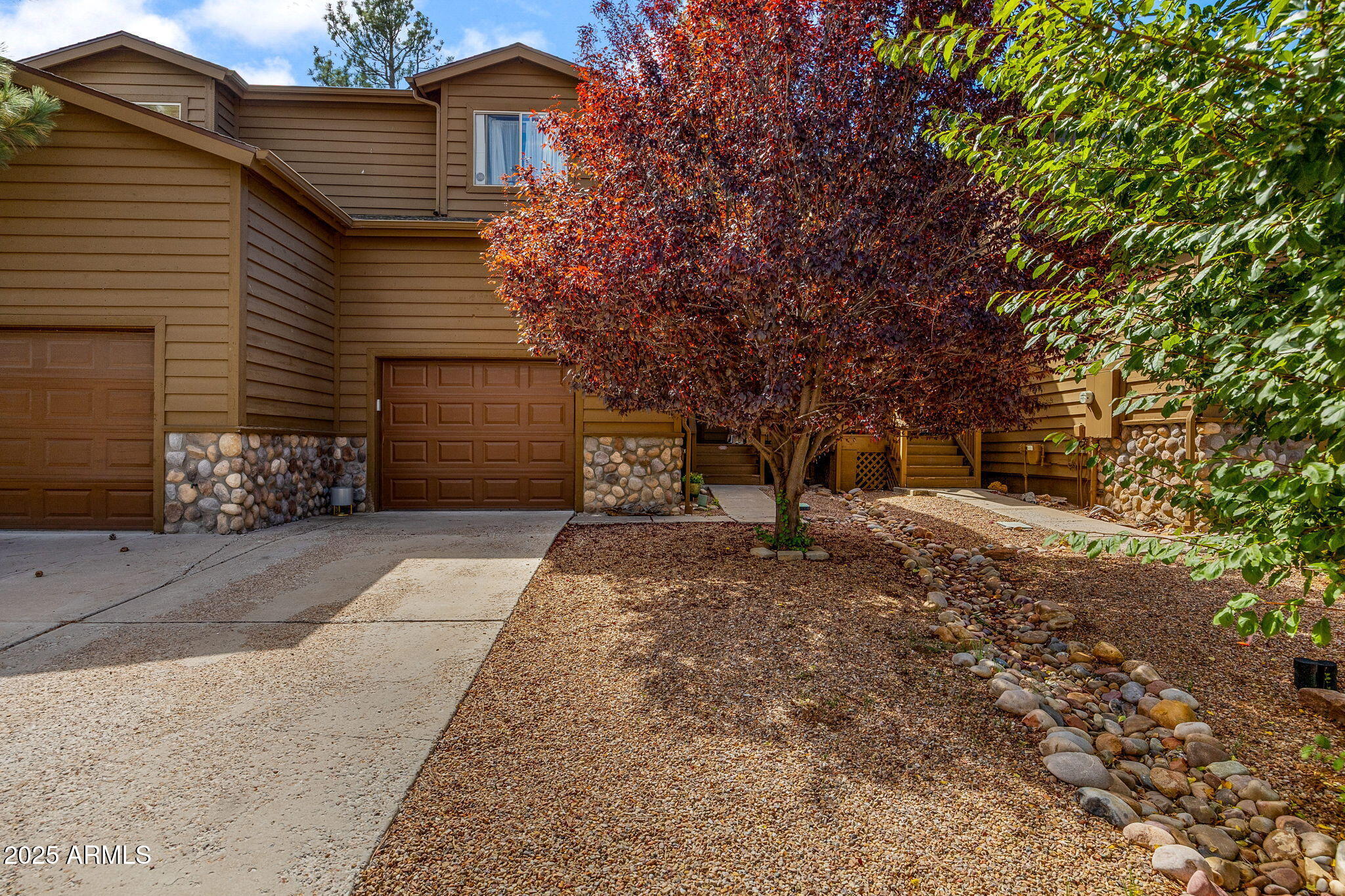 6935 Starlight Ridge Road Lakeside, AZ 85929 - Photo 2 of 32 a front view of a house with a yard and garage