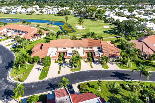 an aerial view of residential houses with outdoor space and street view