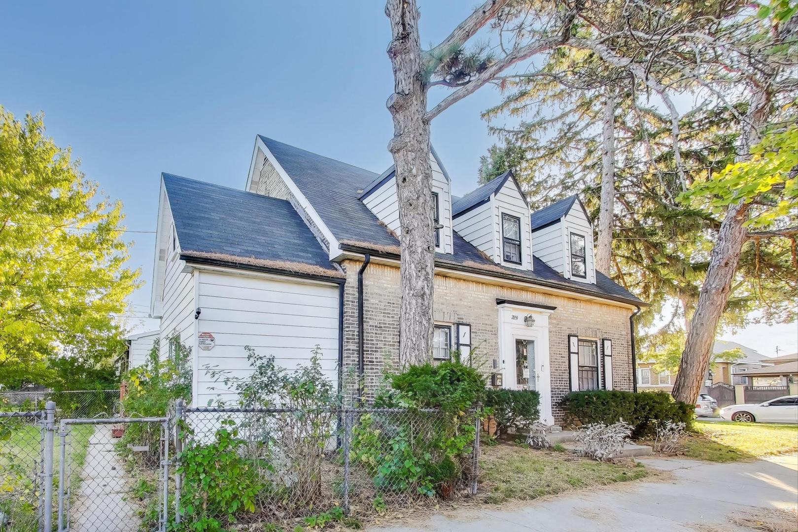 2859 North Mango Avenue Chicago, IL 60634 - Photo 1 of 24 a front view of a house with garden