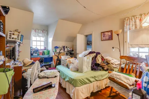 a view of a dining room with furniture and a flat screen tv