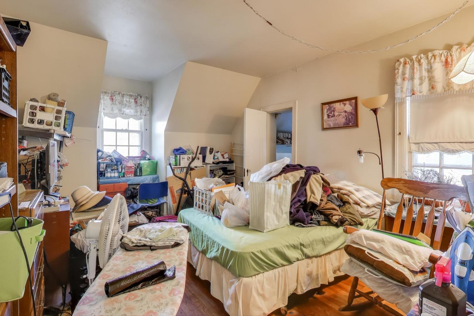 2859 North Mango Avenue Chicago, IL 60634 - Photo 13 of 24 a bedroom with furniture and a window