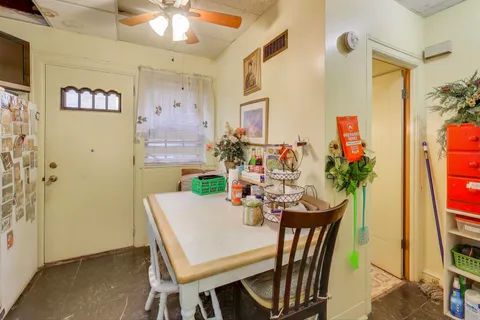 a living room with lots of furniture and baby toys