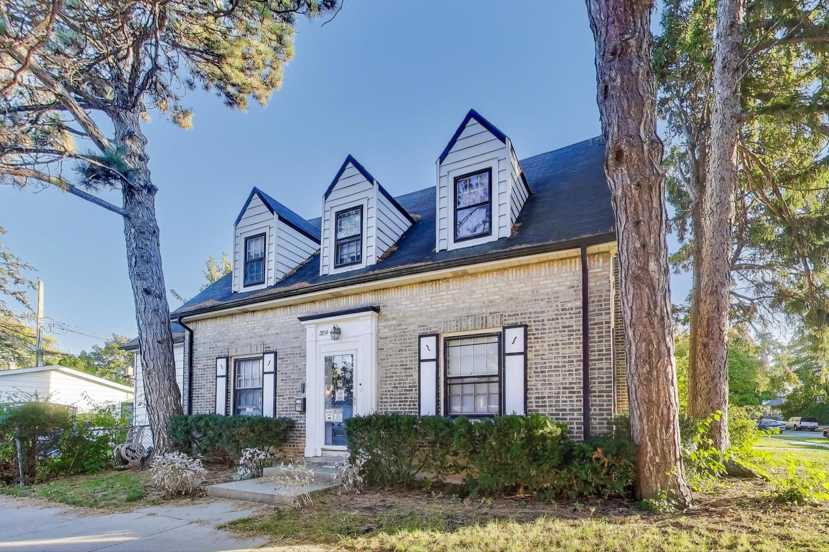 2859 North Mango Avenue Chicago, IL 60634 - Photo 2 of 24 a front view of a house with garden