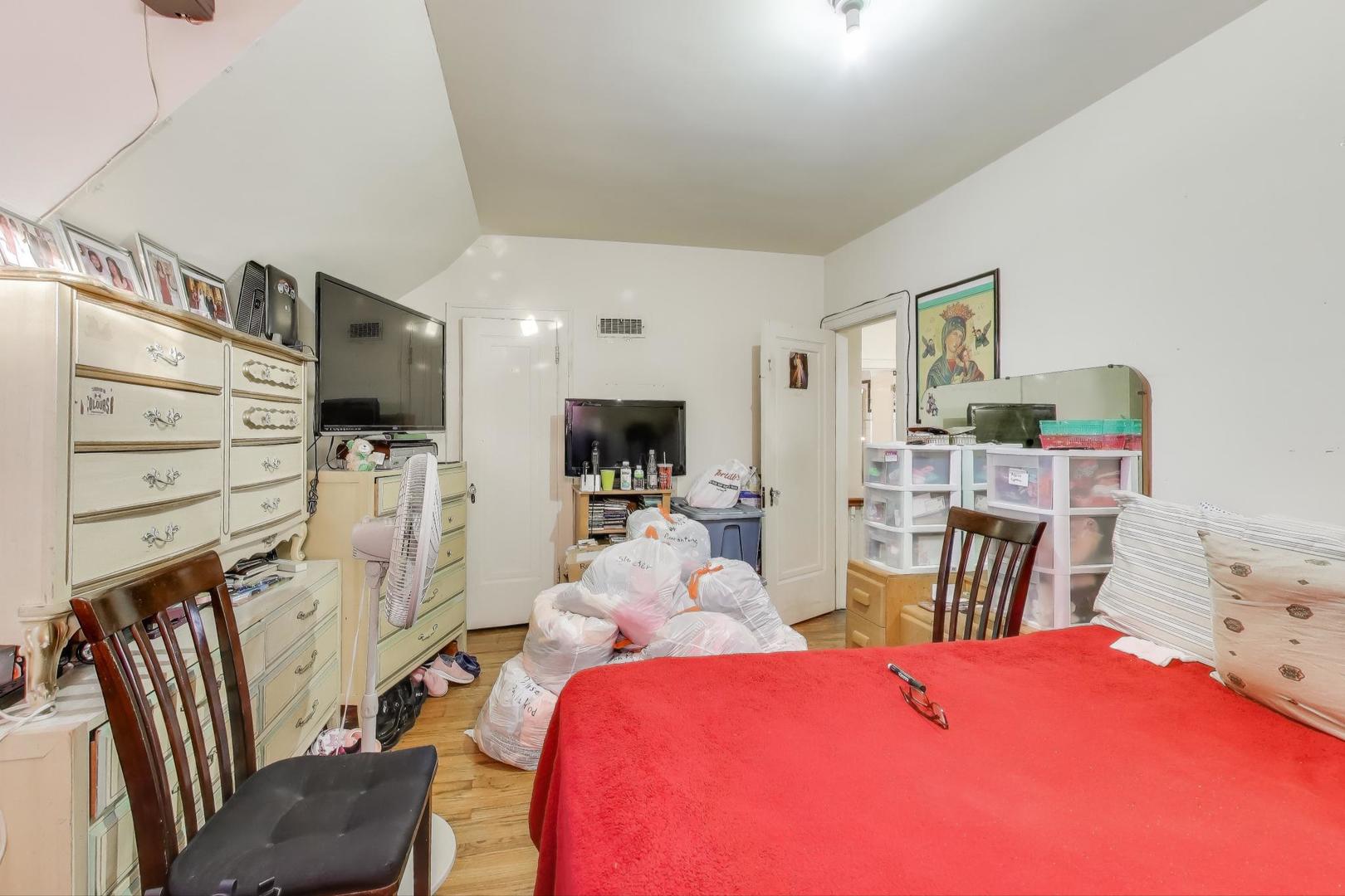 2859 North Mango Avenue Chicago, IL 60634 - Photo 21 of 24 a view of a livingroom with furniture and a flat screen tv